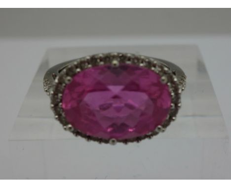 A 10ct gold, diamond and pink topaz ring, weight 4.3g, size P