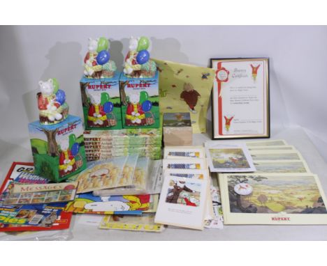 Rupert The Bear - A collection of Rupert The Bear items - Lot to include 7 x 1998 Rupert Annuals. 3 x boxed ceramic Rupert Th