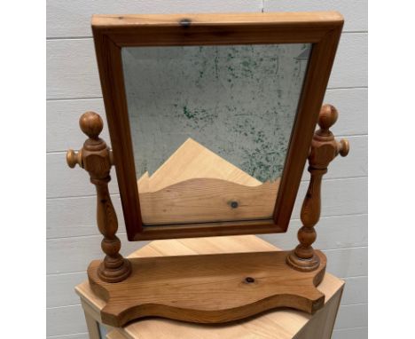 A pine bevel edged bathroom mirror 