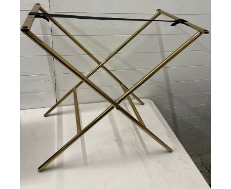 A metal tray frame or luggage rack