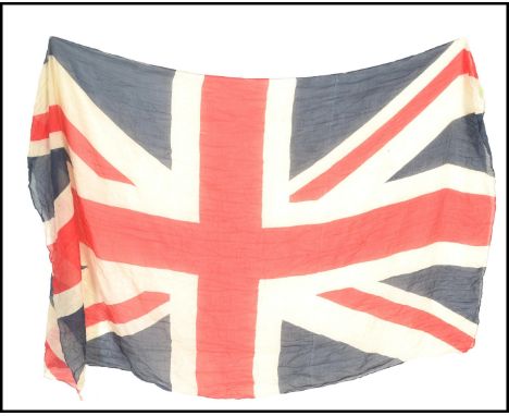 A 20th Century vintage large Union Flag / Union jack flag printed on muslin having stitched seams to the edge.&nbsp; Measures