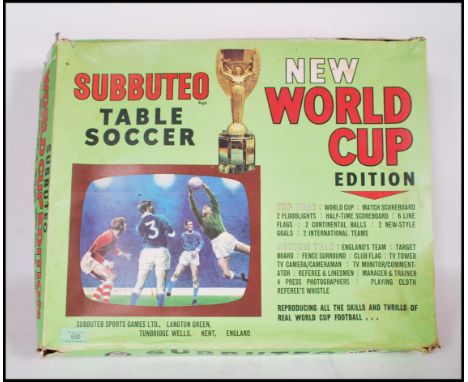 A vintage 20th Century boxed Subbuteo table soccer New World Cup Edition to include International teams, score board, pitch, 