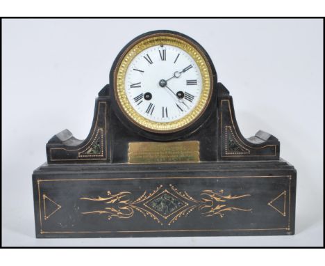 A late 19th Century high Victorian marble mantel clock having white enamel dial with Roman numeral chapter ring with round pi