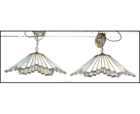 A matching pair of&nbsp;vintage 20th Century Tiffany style leaded glass hanging ceiling light shades in the Art Deco style ha