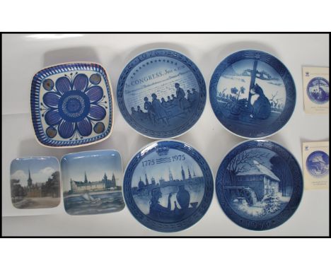 A group of four Royal Copenhagen blue and white porcelain plates to include a Bicentenary 1775-1975, a 1976 water mill plate,