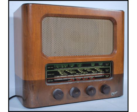 A vintage&nbsp;20th century walnut cased Marconiphone radio having a glass panel to front with bakelite turning knobs below. 