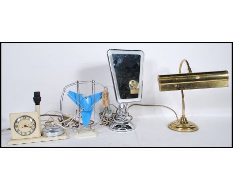 A collection of vintage and retro items to include a brass bankers desk lamp, a retro desk fan, bedside alarm clock / lamp co