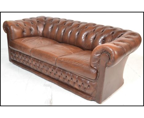 A good Victorian style chesterfield three seater sofa of good proportions, deep button back upholstered with scroll back and 