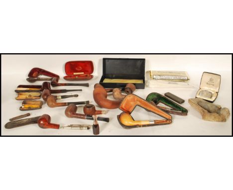 A good collection of vintage smoking tobacco pipes and&nbsp;accessories to include various leather cased pipes, some pipes ha