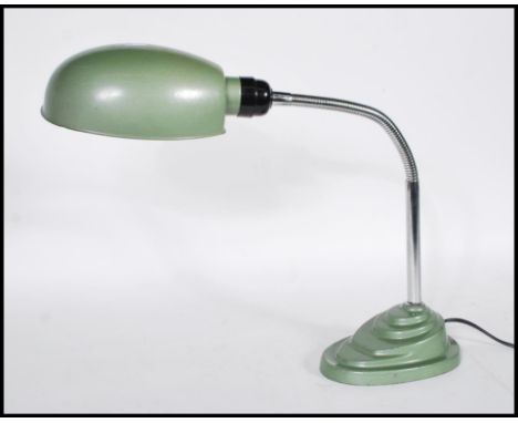 A retro mid 20th Century 1960's industrial desk / table lamp having&nbsp;articulated chrome gooseneck on a stepped green fini