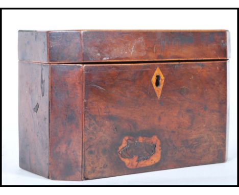 A late 18th Century Georgian tea caddy having canted corners with scutcheon to the front and hinged lid, key still present. M