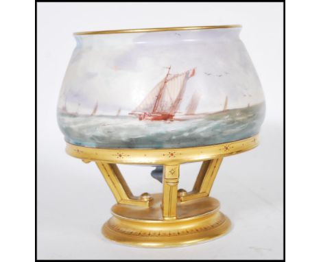 A 20th Century ceramic vase having a bulbous body with hand painted maritime decoration of ships sailing, raised on a ceramic