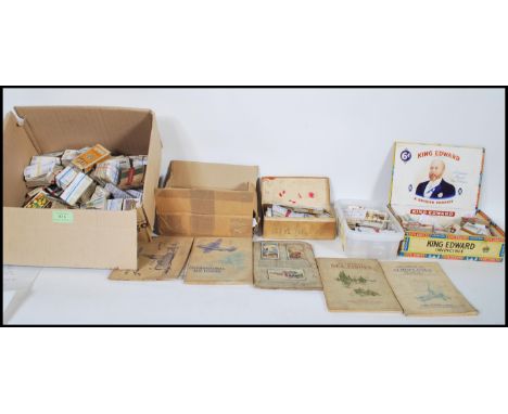 A collection of vintage cigarette cards and tea trade cards dating from the early 20th Century, mostly grouped part sets from