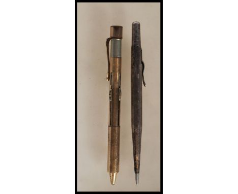 A stamped sterling silver propelling pencil by Lifelong of hexagonal form having engine turned decoration to shaft. Together 