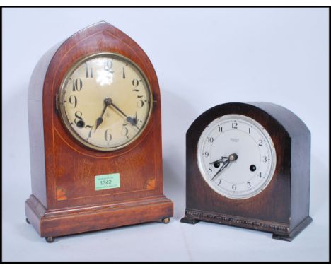 Two 20th Century mantel clocks to include an Edwardian wooden cased mantel clock with satin wood inlay having a round face wi