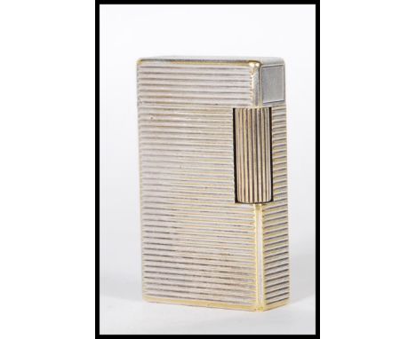 A vintage 20th Century Dupont of Paris white metal pocket lighter having striped decorated body. Stamps to base. Measures 6cm