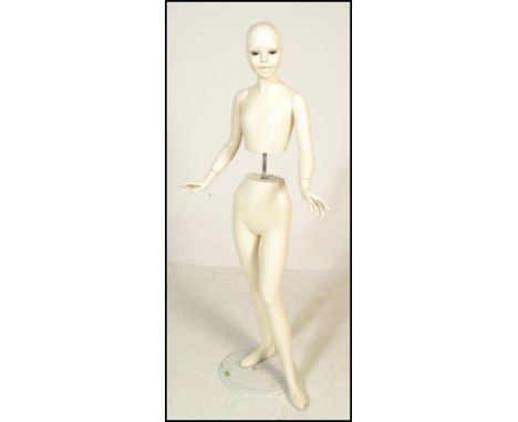 Pierre Imans, Paris- An early 20th Century wooden, white painted&nbsp;point of sale shop advertising display mannequin of chi