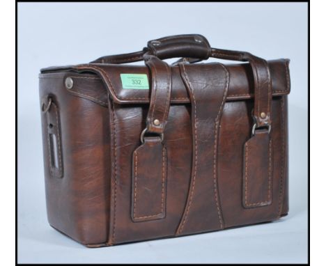 A vintage 20th Century 35mm Cannon A-1 camera, lenses and accessories, all housed in original period case.