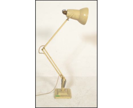 A vintage early 20th Century Herbert Terry anglepoise desk lamp having a pendant shade with adjustable sprung arm raised on a