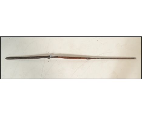 A vintage possibly African tribal Masai double ended hunting / Lion spear, the double ended spear having a carved wooden cent