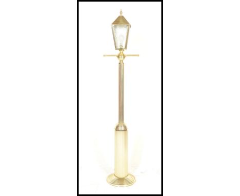 A retro 20th Century&nbsp;upright floor standard lamp in the style of a Victorian street lamp having a gilt brass effect fini