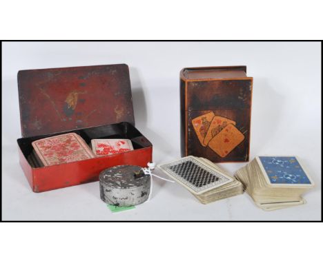 A 19th Century Chinese metal music box having hand painted oriental scene with winding handle atop and remnants of a paper la