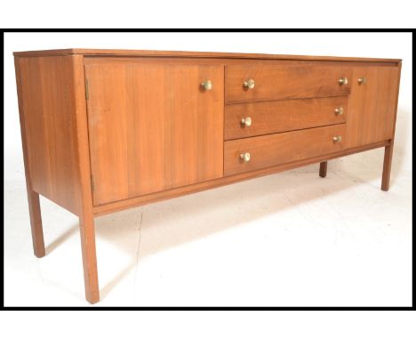 A vintage retro 20th Century teak wood Danish sideboard credenza, flared top over a central bank of three drawers flanked by 