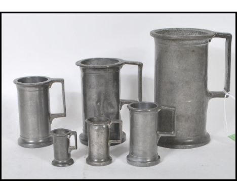 A set of six graduating 18th / 19th Century French apothecary pewter measuring cups. Each measure bearing press marks with so