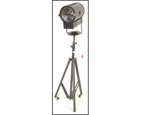 A 20th Century vintage stage /&nbsp; film / theatre spotlight of tubular form raised on a extendable metal tubular&nbsp; trip