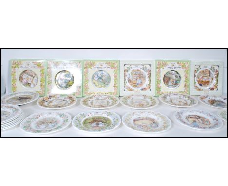 A group of 22 Royal Doulton Brambly Hedge ceramic collectors plates along with a wall clock to include the four seasons, four