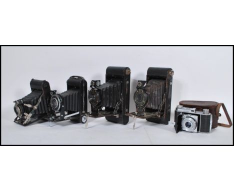 A collection of vintage 20th Century fold out cameras to include Kodak Six-20 Junior deluxe, Kodak No 2a folding cartridge Ha