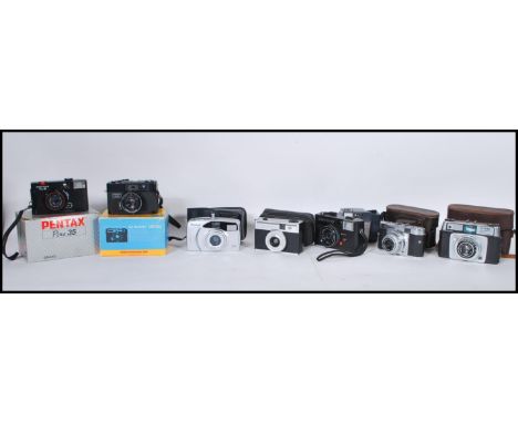 A collection of vintage 20th Century 35mm cameras of various makes to include Pentax Pino 35, Chinon 35EE, Polaroid PZ2001, A