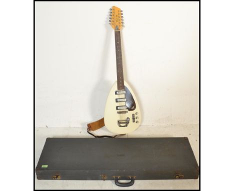 A rare vintage 1960's VOX Mark XII made 12 string ' Teardrop ' electric guitar. White body with mother of pearl inlaid fretbo