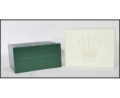 A vintage Rolex watch Geneve Suisse&nbsp;box having a green leather finish with a wave design panel to the lid and gilt logo 