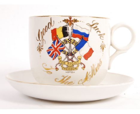 An early 20th century WWI First World War large oversized ' Good Luck To The Allies ' teacup and saucer. Gilded decoration wi