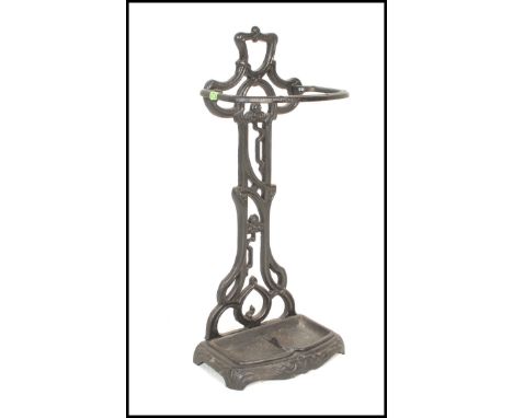 A 20th Century cast iron two sectional stick stand in the manner of Coalbrookdale having an ebonised painted finish. The stan