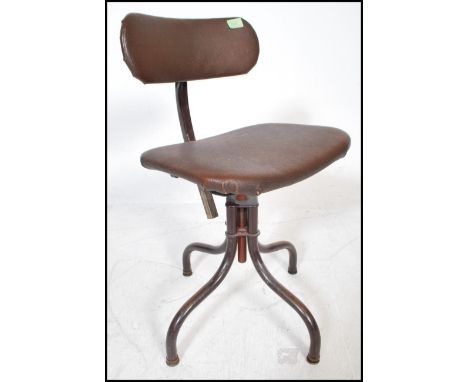 A retro vintage 20th Century industrial machinists swivel chair having a quadrapod base and central column seat and backrest 