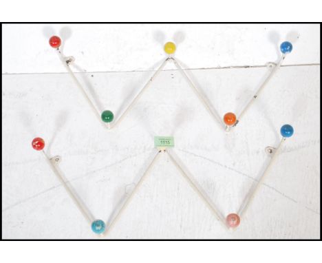 A pair of vintage retro mid 20th Century sputnik atomic space age set sof coat hooks of W zig zag form having alternating col
