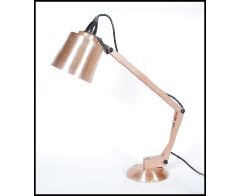 A retro 20th Century copper and plastic&nbsp;angle poise Mac Lamp, model number 8. Raised on a circular base with original pe