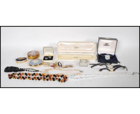 A collection of vintage costume jewellery to include a Tissot Seastar wrist watch with date aperture along with another simil