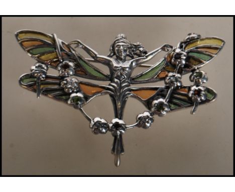 A stamped 925 silver and enamel plique a jour Art Nouveau style brooch in the form of fairy with her wings fully expanded and