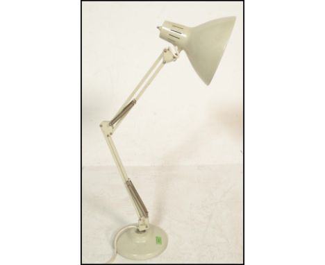 A vintage retro 20th Century 1001 Lamps anglepoise lamp raised on a circular base with conical enamel pendant shade. Measures