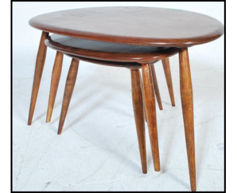 Lucian Ercolani - Ercol - Pebble - A vintage mid 20th Century set of three beech and elm wood nest of table raised on spindle