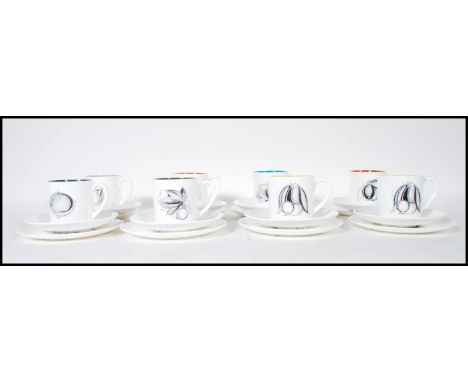 A retro Susie Cooper for Wedgwood coffee service in black fruit pattern to include eight coffee cans, saucers and side plates