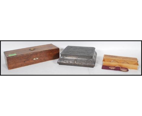 A collection of items to include; a vintage shaped and embossed chocolate tin, a vintage wooden box with inlaid photograph to