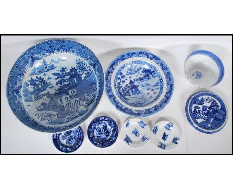 A group of 19th Century blue and white English china wares to include a large willow pattern centrepiece bowl, a Spode bowl, 