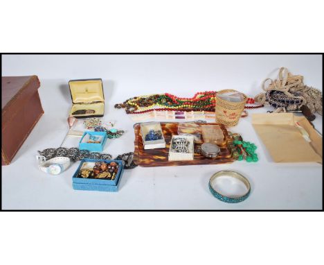 A collection of costume jewellery and other items to include various buttons, earings, belt buckles, necklaces, bracelet/ ban
