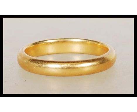 A hallmarked 22ct gold wedding band ring. Hallmarked Birmingham 1934. Weight 4.1g. Size J.&nbsp;