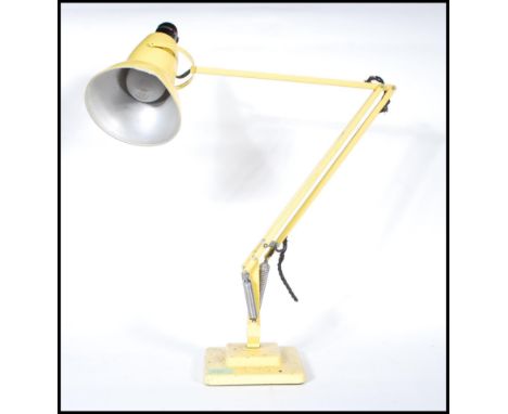 A vintage mid 20th Century retro Herbert Terry Anglepoise table / desk lamp in original yellow painted finish. Features a sol