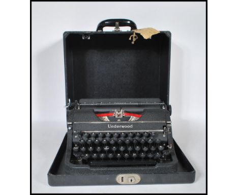 A vintage early 20th Century circa 1930's Underwood universal portable reporters typewriter, in fitted black case. Made in th